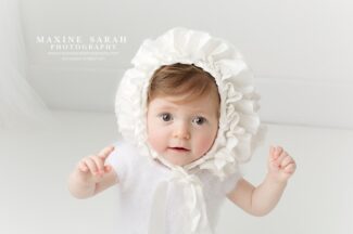 baby in a bonnet baby photographer